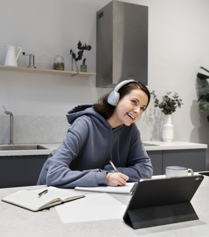woman-working-from-home-kitchen-with-tablet